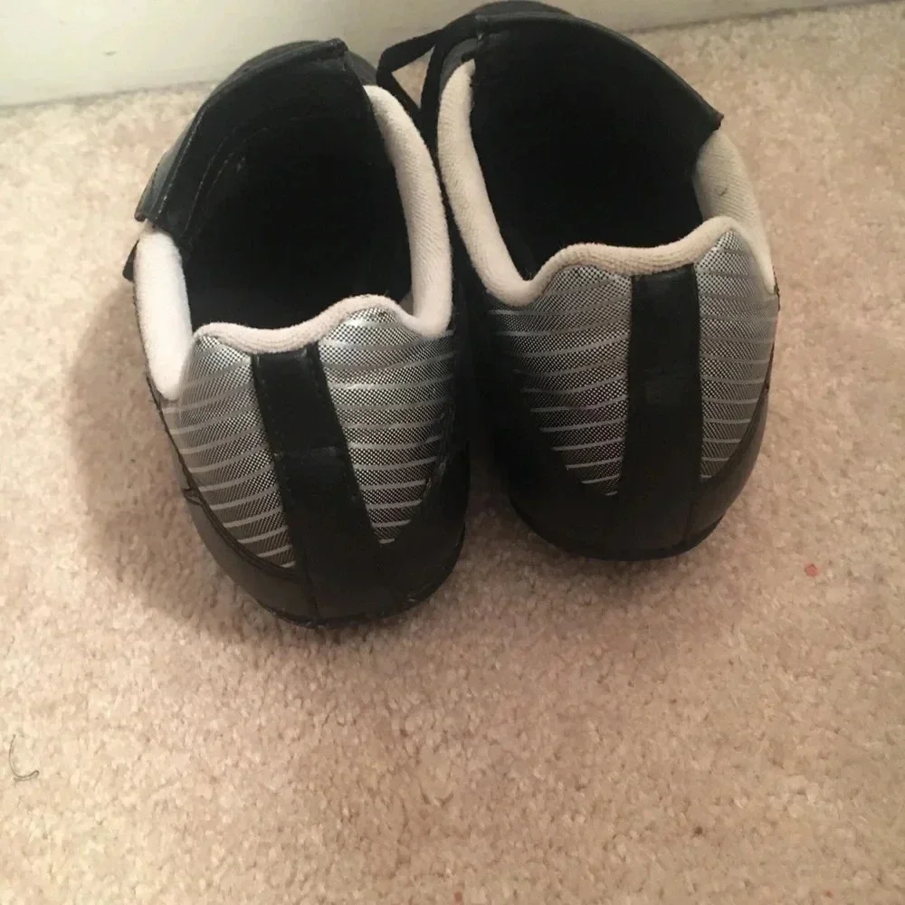 Nike kids cleats size 4 back and white sports cleats